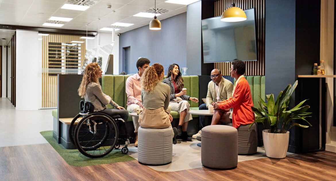 Business team meeting in modern office sitting area - Inclusive Recruitment