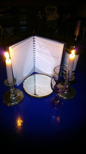 Reflective journal by candlelight